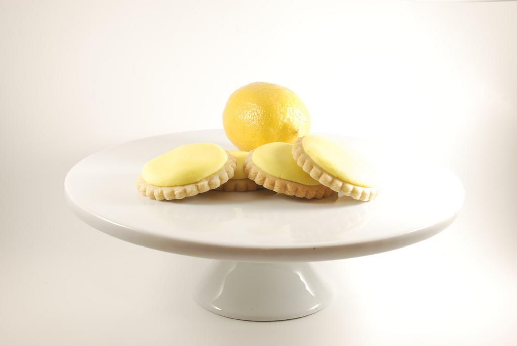 Lemon Creme Cookie · Does love lemon stand freshness?  Well, an image that in a buttercream frosting on a hand made sugar cookie! That's the delightful flavor or our lemon creme cookie. The smell of fresh lemons is very refreshing. Each cookie is individually wrapped.