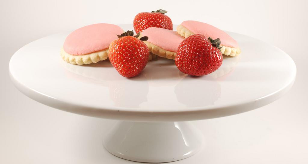 Strawberry Creme Cookies · Delicious, individually wrapped signature cookies with buttercream strawberry frosting. The cookie is on a vanilla cookie. Each cookie individually wrapped.