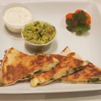 Quessadillas · Jalapenos quesadillas served with guacamole and sour cream. Add choice of meat or vegetable ...