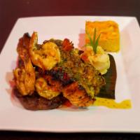 Surf And Turf · Garlic buttered pan grilled steak, served with shrimps