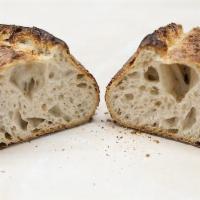 She wolf Sourdough · Unlike traditional yeast bread, this sourdough utilizes a “starter” made of water and flour....