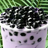 Taro Milk Tea · Rich tasting taro milk tea with a deep natural sweetness and nutty flavor topped with tapioc...