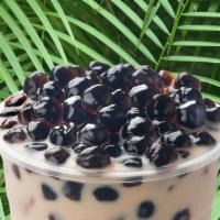 Coconut Milk Tea · Sweet and smooth coconut milk tea topped with tapioca pearls.