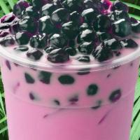 Watermelon Milk · Sweet watermelon milk tea topped with tapioca pearls.