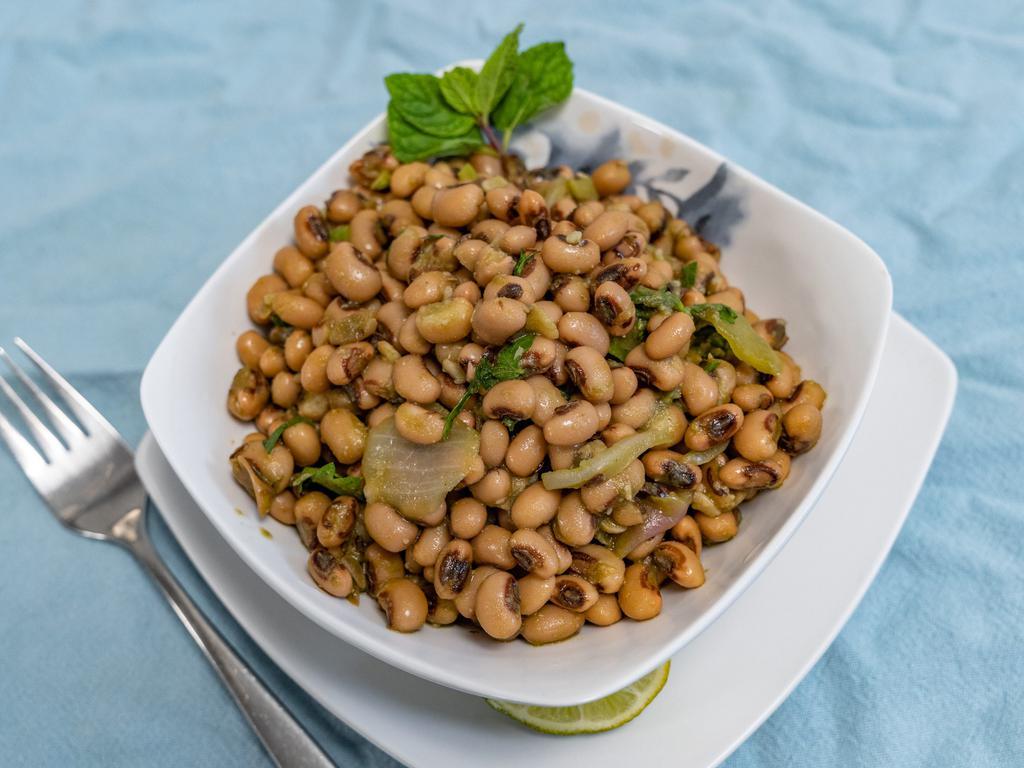Black-Eyed Pea Salad · Team favorite, chef's special black-eyed pea salad with veggies, super fresh lime - cilantro dressing. Fresh and healthy salad craving, perfect on its own or side to burger or topped with plant based protein or tandoori chicken for an additional charge.