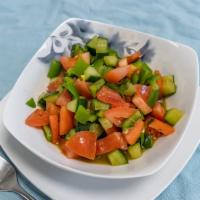 Kachumber Salad · Sweet-tangy tomatoes, crunchy cucumbers and piquant onions go well with almost any Indian di...