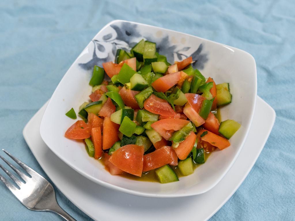Kachumber Salad · Sweet-tangy tomatoes, crunchy cucumbers and piquant onions go well with almost any Indian dish. Having some fresh, raw veggies with your meal or as a meal with tandoori chicken or cilantro chicken or plant-based burger without bun for an additional charge.