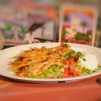 Shrimp Quesadilla · Served with cheese and sour cream, lettuce, and pico de gallo on the side.