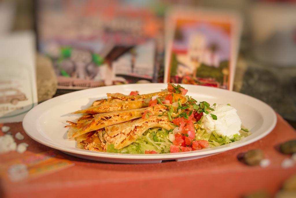 Shrimp Quesadilla · Served with cheese and sour cream, lettuce, and pico de gallo on the side.