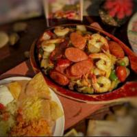 Fajita Mix · Grilled chicken, steak, chopped onions and peppers, Chorizo and sautéed jumbo shrimp. Serve ...