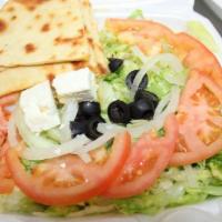Greek Salad · Our salad comes with lettuce, tomatoes, onions, olives, feta cheese, fluffy pita bread and o...