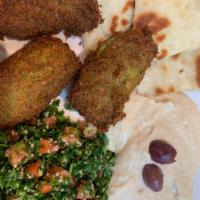 Falafel Dinner · Our falafel is homemade from scratch and includes our homemade tabouli, hummus, pita bread a...