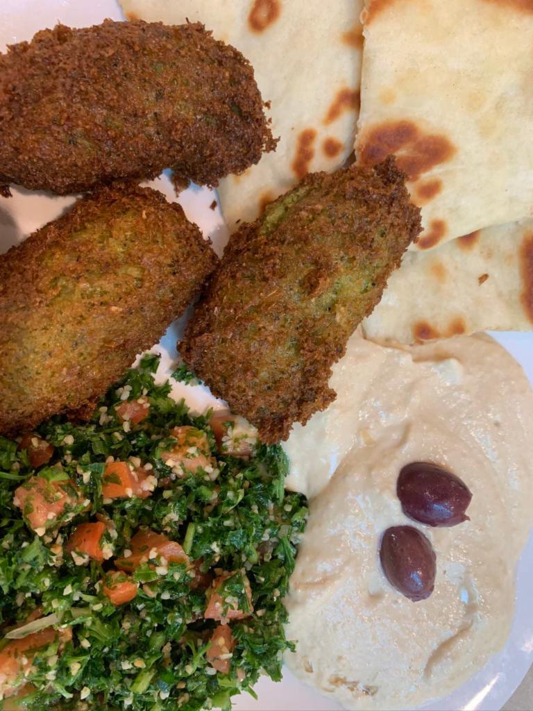 Falafel Dinner · Our falafel is homemade from scratch and includes our homemade tabouli, hummus, pita bread and tzatziki.