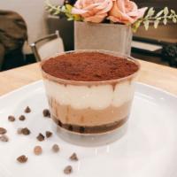 Tiramisu Cake · Coffee and Zabaione cream on a layer of sponge cake soaked in espresso, dusted with cocoa po...