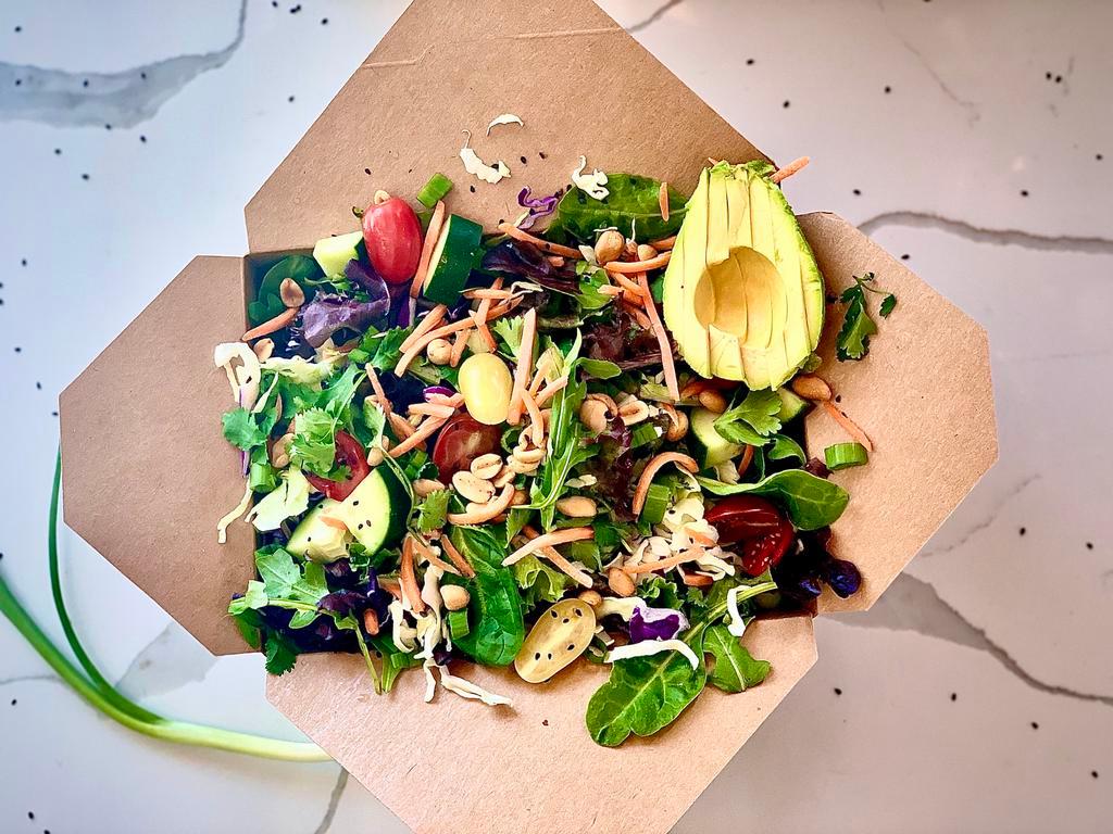Asian Style Salad with Sesame Dressing · Sesame Dressing - Vegan, Keto, Gluten Free, Contains Peanuts. Organic mixed greens, shredded cabbage, avocado, shredded carrots, cherry tomatoes, cucumber, sesame seeds, fresh cilantro, green onions, and dry roasted peanuts (Vegan).