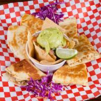 Chicken Quesadilla · Fresh toasted tortillas (3), stuffed with our hand mixed quesadilla cheese & mesquite grille...
