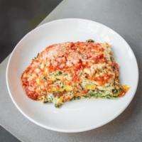 Vegetarian Lasagna · 5 layers of ricotta and spinach and house-made lactose free Bechamelle, topped with hand cra...