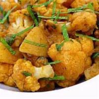 Aloo Gobi · Potato and cauliflower cooked with curry sauce and spices. Spicy.