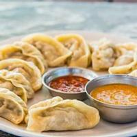 10 Piece Chicken Momo · Dumplings. Boneless chicken, onion, garlic, ginger and Indian spices wrapped in pastry gow (...