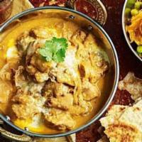 Chicken Korma · Boneless skinless chicken cooked in creamy onion sauce with cashews and almonds. Spicy.
