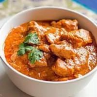 Chicken Curry · Boneless chicken cooked in curry sauce and spices.