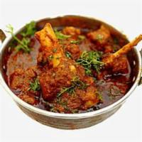 Goat Kadai · Tender goat cubes cooked with tomatoes, onions, bell peppers, ginger and garlic. Spicy.