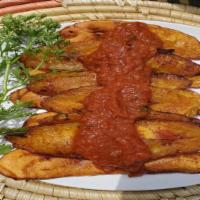  Fried plantain W/ Stew  · Delicious deep-fried ripe plantain served with stew