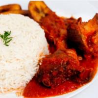 Steamed Rice with Stew · Steamed mildly salted long grain rice to be eaten with savory fried tomato stew or with trad...