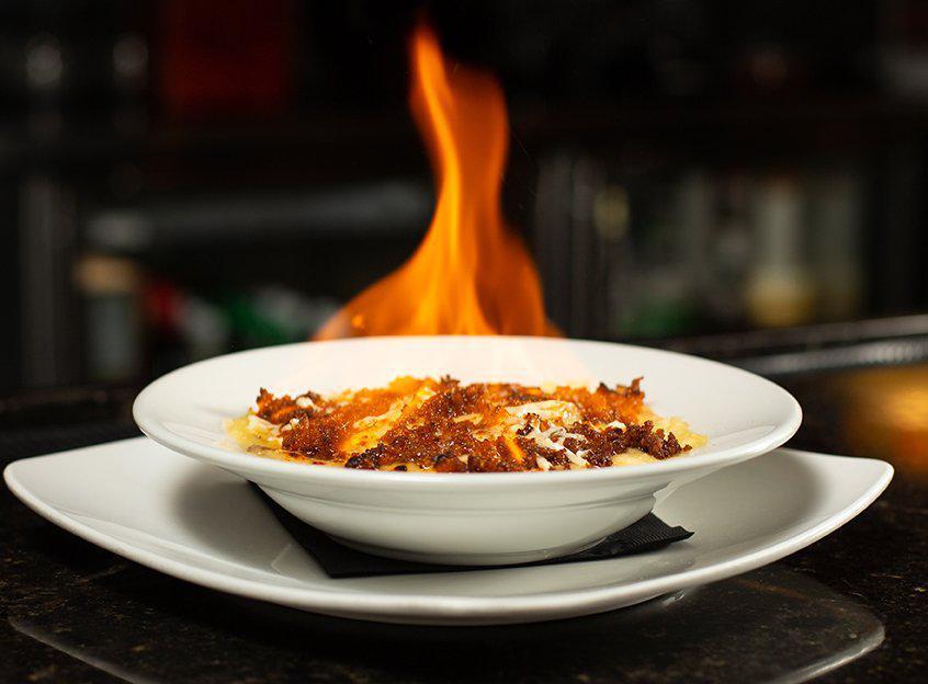 Queso Fundido · A robust combination of grilled chicken, chorizo and Chihuahua cheese blended with Bacardi 151 Rum, set ablaze and served flaming. Delicious!