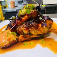 Pollo de la Mama · Bone-in, roasted 1/2 chicken with Mexican herbs, served with Mexican rice & refried beans, s...