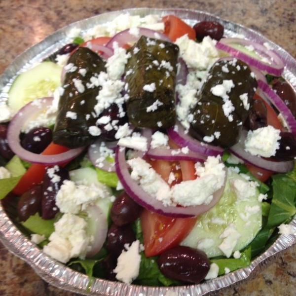 Greek Salad · Romaine feta cheese, grape leaves, kalamata olives, red onion, tomato and cucumbers.