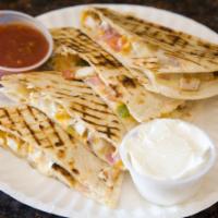 Grilled Chicken Quesadilla · Flour tortilla, jack and cheddar cheese, pico de gallo, salsa, and sour cream.