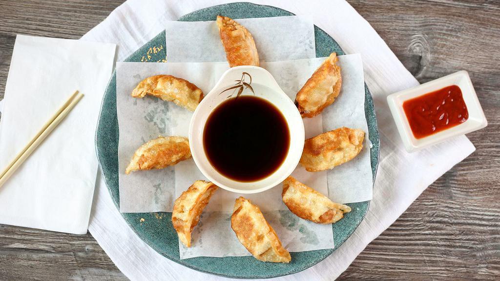 Gyoza · 8 Japanese dumplings filled with chicken and vegetables, served either fried or steamed with a side of gyoza sauce.