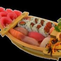 Sushi Boat · 5 pieces tuna sashimi, 6 pieces nigiri sushi, 8 pieces spicy tuna roll and seaweed salad.