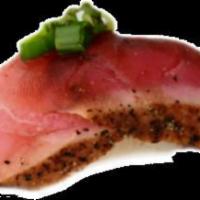 Blackened Tuna Nigiri · Sushi laid top of rice.