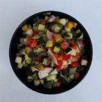 Mediterranean Salad  (Vegan) · Olive oil citrus dressing diced cucumber, radish, tomato, red onion and mixed bell peppers.