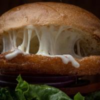 Fish Burger · Fish fillet, lettuce, tomatoes, and red onions. Served with tartar sauce.