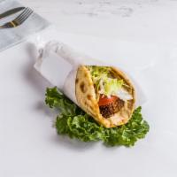 Falafel Sandwich · Mediterranean blend falafel, served with lettuce, tomatoes, onion, and hummus on a pita brea...
