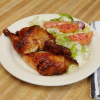#1 Whole Rotisserie Chicken Combo · Served with large rice, medium beans, salad and two cans of soda.