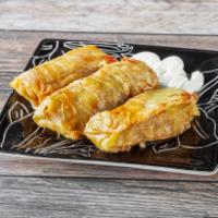 Dolma  · 3 Cabbage rolls with ground beef & chicken with rice and spices - Served with Sour Cream and...