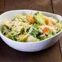 Caesar Salad · Chopped romaine lettuce topped with croutons and Parmesan cheese and Caesar dressing.