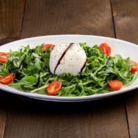 Burrata Cheese · Served with baby arugula, cherry tomatoes. Olive oil and balsamic glaze dressing.