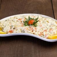 Russian Salad · Green peas, potatoes and carrot mixed with mayonnaise.