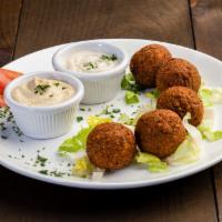 Falafel Plate · Ball shaped chickpeas mixed with parley, seasoning and deep fried. Served with hummus and ta...