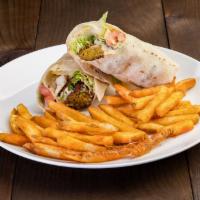 Falafel Wrap · Rolled up In a lavash bread, with lettuce, tomato with hummus and tahini sauce served with f...