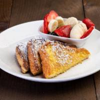 French Toast · Served with fresh fruit and decorated with powder sugar.