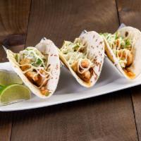 Shrimp Taco · 3 soft com tortillas filled with grilled marinated shrimp, onion, cilantro and spicy garlic ...
