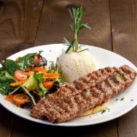 Adana Kebab · Hand chopped lamb mixed with red bell peppers, seasoning, and grilled on skewer. Served with...
