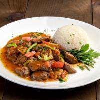 Beef Saute · Chunks of meat sauteed with onions, mushrooms, peppers, tomato and seasonings. Served with r...