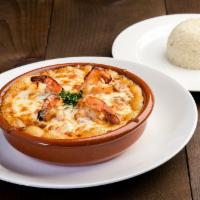 Shrimp Casserole · Shrimp sauteed with mushrooms, tomato, onions, peppers and topped with cheese. Served with r...